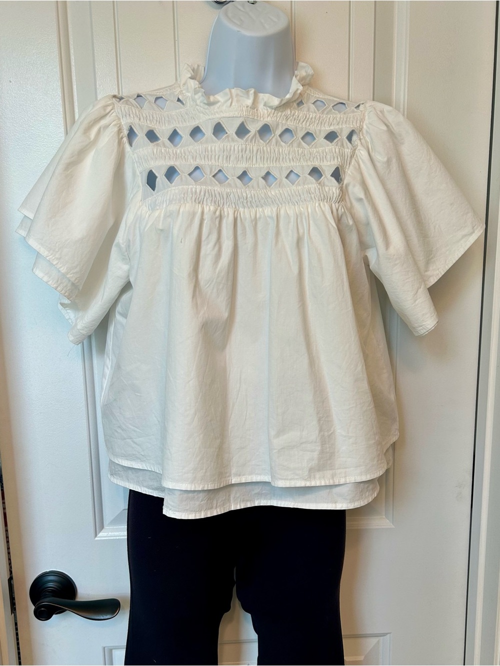 White Smocked Yoke Puff Sleeve Blouse with diamond cutouts. Size small.